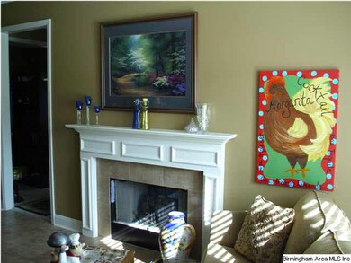 OTHER SIDE OF FIREPLACE OPENS INTO HEARTH ROOM