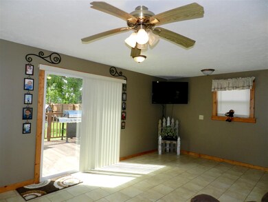 Family room with ceramic tile floors, sliding glas