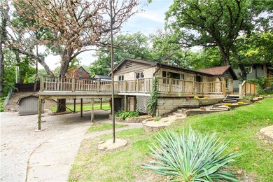 Car port below large deck, new landscaping