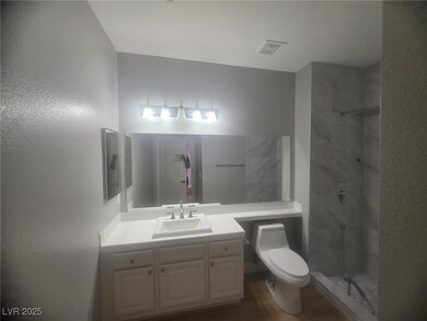 Freshly painted cabinets and new shower. Primary bathroom.