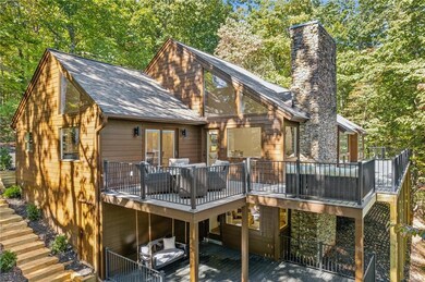 Rear view of house with a wooden deck