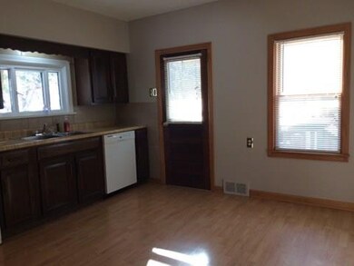 Another view of the kitchen with access to the bac