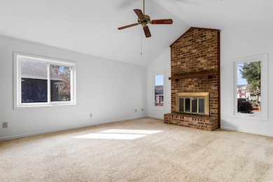Unfurnished living room with ceiling fan, carpet f