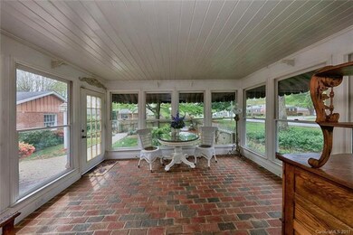 BRICK FLOORED SUNROOM. A PERFECT PLACE TO ENJOY YO