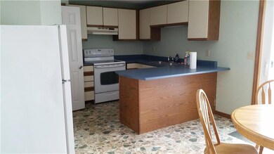 spacious eat in kitchen with half...