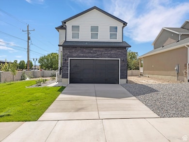 View of front of home featuring driveway and an attached garage