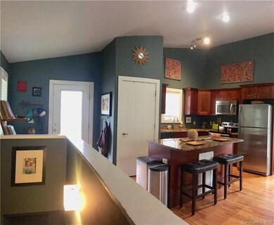 Open floor plan with vaulted ceilings