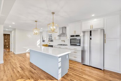Brand New Kitchen with an Island and Breakfast Bar
