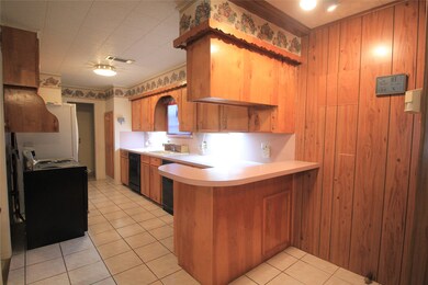 Custom Cabinets in Kitchen and a Breakfast Bar / Serving Counter on the end