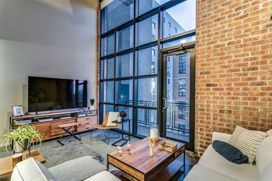 Living room featuring a wall of windows and a high