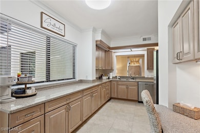 Kitchen with light tile patterned floors, visible