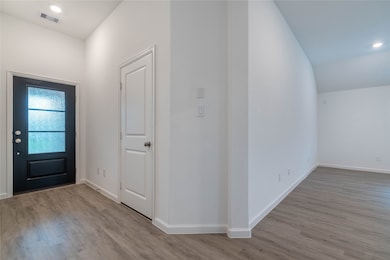 Front Entry has Beautiful Decorative Iron/Glass Door with Garage Directly to Left and Entry Closet on Right