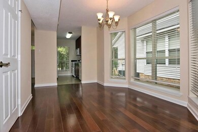 Dining Area with the Kitchen in the background.