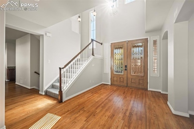 Foyer featuring hardwood / wood-style floors and f