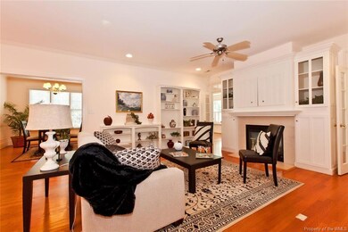 Great Room With Built In Cabinetry Over Fireplace 