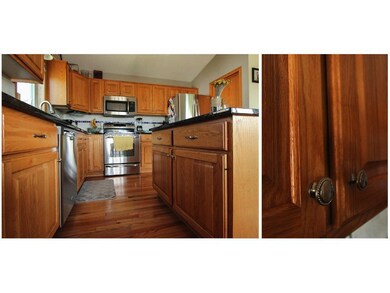 Well-built raised-panel oak cabinetry provide tons