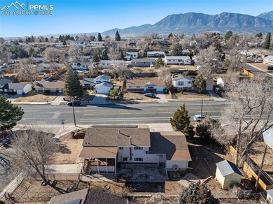 Aerial view facing the rear of the home with mount