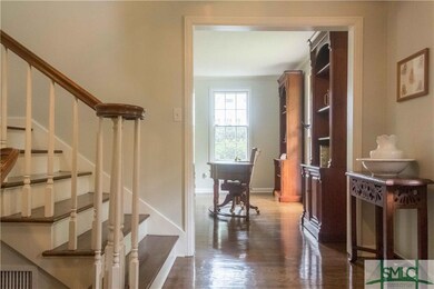 Entrance foyer with lovely, sweeping staircase.