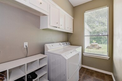 Large laundry room with tons of storage space.
