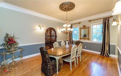 Formal dining room with wood floors and access to 