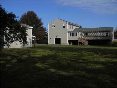 Exterior Back. Large fenced in yard.