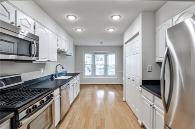 Stainless appliances, adequate lighting and wood floors.