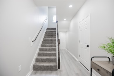 View of stairs from front door leading to the seco