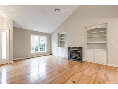 Living Room with gas fireplace + custom cabinetry