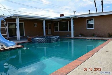 Rear exterior view and pool/spa