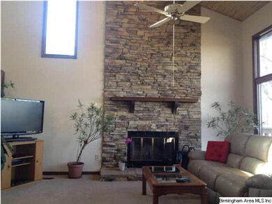 rock fireplace, vaulted ceiling