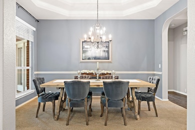 Dining space featuring a chandelier, carpet floor