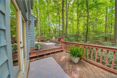 French doors from living room open to this deck ar