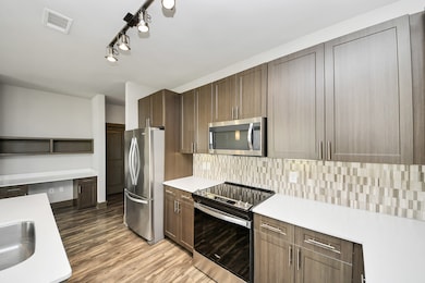 Photos are not of actual units, similar floor plan finishes, verify dimensions