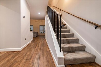 Stairs with recessed lighting, baseboards, and woo