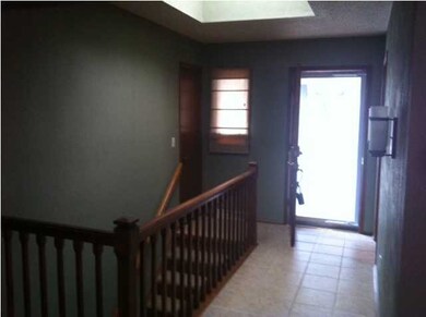 Foyer with Tile and a Sky Light