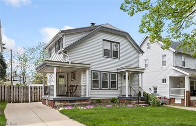View of front of home featuring a front lawn and covered porch