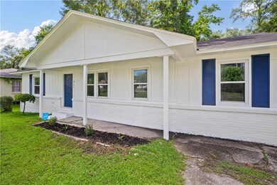 View of front of home featuring a front lawn and brick siding