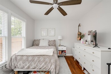 Bedroom with dark wood-style flooring, a ceiling 