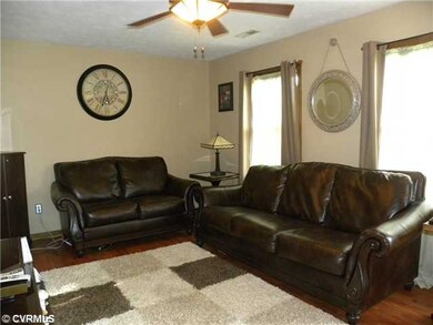 Living Room - Living Room with laminate floor and 