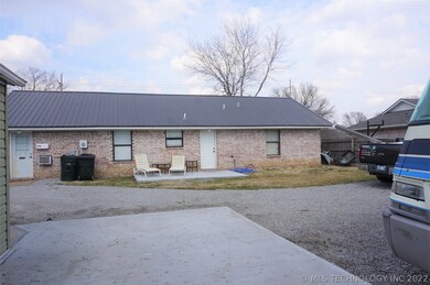 Back of residence with parking area