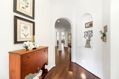 As you enter through the front door your eyes are drawn to the BEAUIFUL WOOD flooring and fresh neutral white walls and trim. To the right is 2 guest rooms and guest bathroom between them. To the left outside the foyer is the formal dining room.