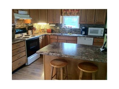 Kitchen. Gorgeous oak kitchen with large island!!