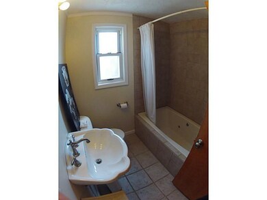 Full Bath. Updated with ceramic tile, this main fl