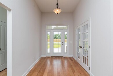Entry with beautiful wood flooring