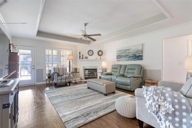 BEAUTIFUL Living room has rich wood floors, soothi