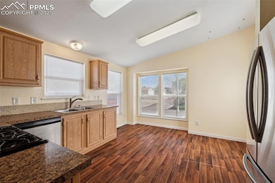 Kitchen with ample natural light and stainless apppliances