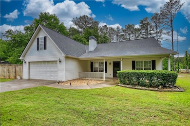 View of front of house with covered porch, drivewa