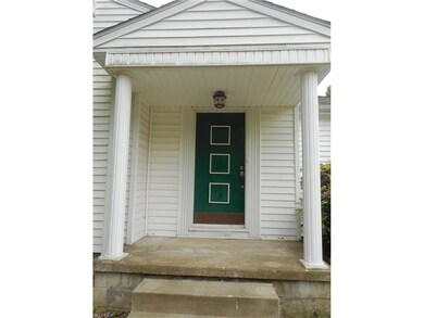 The covered front porch welcomes the guests into y