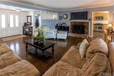 View of front door and Living Room with Fireplace