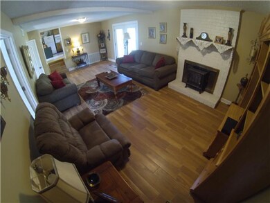 A spacious bonus room area on entry level complete with beautiful new flooring and french doors leading to the patio.